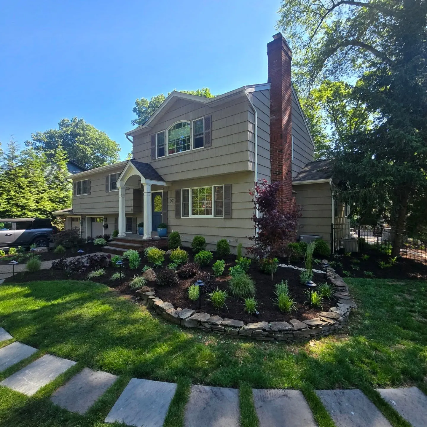 Finished front-yard interlock walkway and garden by Top Down Landscaping in Toronto